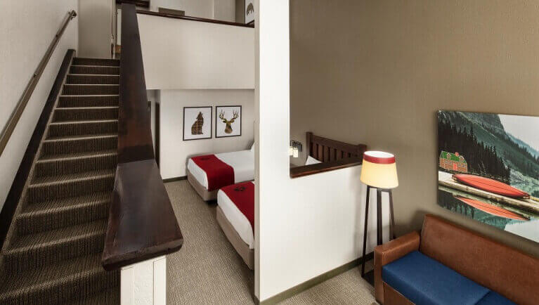 The stairs and downstairs area in the accessible Loft Fireplace Suite